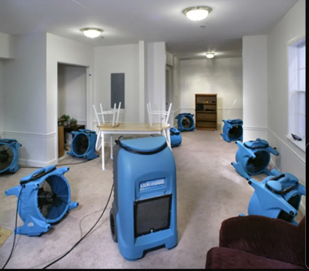 Air movers and dehumidifier setup for Water Damage Restoration in Whiskey Creek